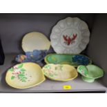 A collection of Carlton ware together with a catalogue to include an Oyster dish decorated with a