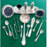 Two small silver photograph frames, silver plated condiments, flatware and sugar tongs Location: