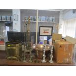 A mixed lot of copper and brassware to include a companion fireside set,16 candlesticks and others