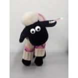 Steiff- A Shaun the Sheep, high quality black and white plush, having a rotating head and wearing