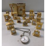 A collection of miniature brass and other clocks along with reproduction pocket and quartz