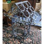 A wrought iron garden centrepiece with central hanging basket, the top made from horseshoes 84cm h x