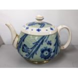 Circa 1900 James Macintyre Burslem teapot decorated with scrolling foliage in shades of blue and