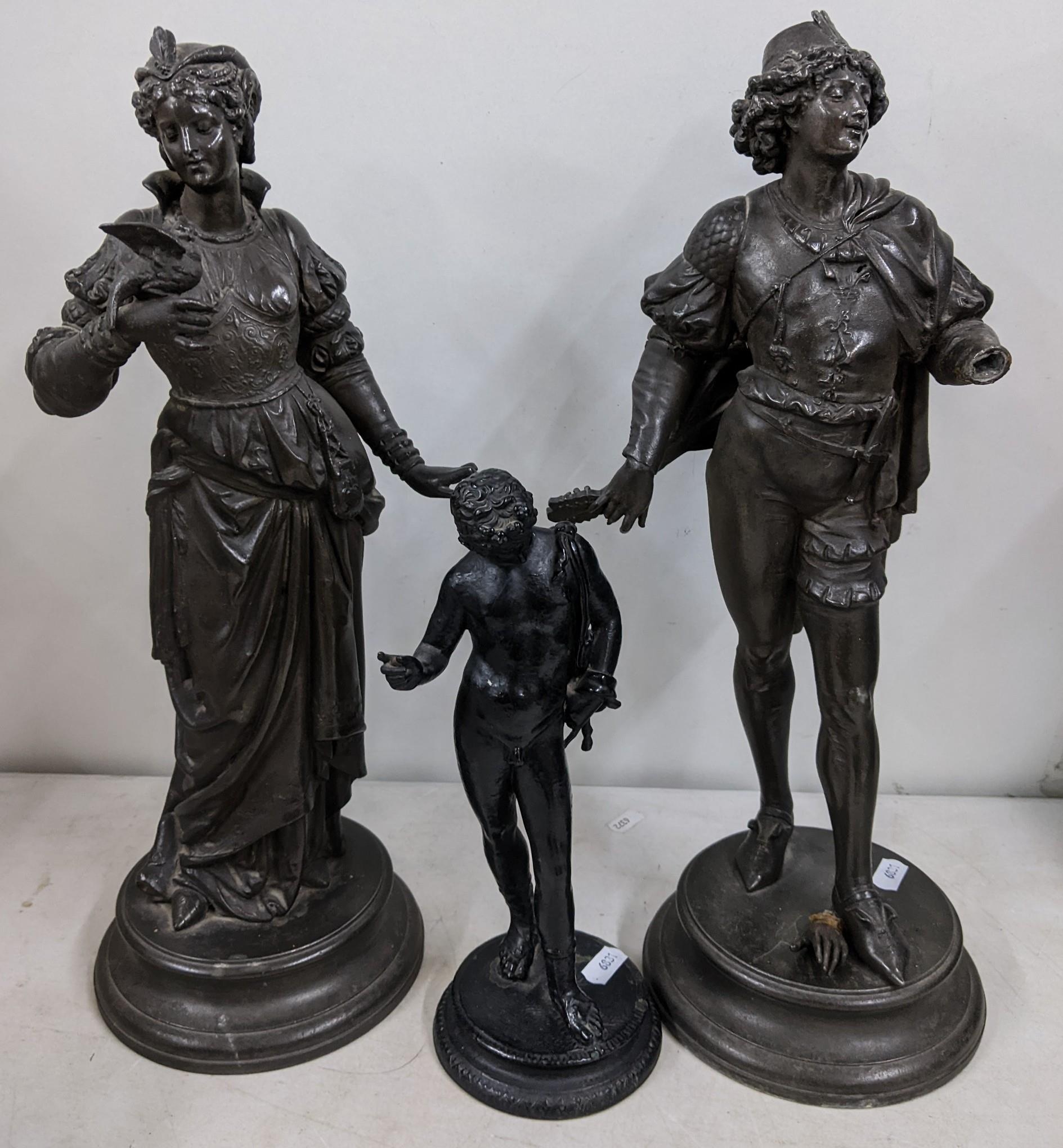 Three Victorian spelter figures to include one of a lady with a bird perched on her hand Location: