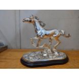 An Italian silver plated model of a horse signed Marcello Giorgio on a naturalistic base and