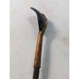 A copper ladle with a turned wooden handle Location:LWM