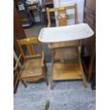 A child's metamorphic high chairs with tray, and a late 19th century child's commode chair, with tin