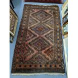 An Afghan hand woven rug having a brown ground and diamond motifs, 222cm x 130cm w Location: