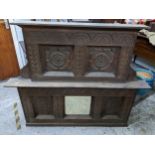 A 19th century carved oak sideboard mirrored top having flower head and leaf carved panels and