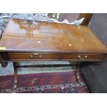 A reproduction mahogany sofa table, two frieze drawers, on trestle ends united by a turned