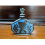 An early 20th century white metal and sky blue enamelled scent bottle, each side decorated with a