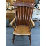 A late Victorian elm seated Windsor lath back armchair on turned supports Location: