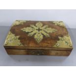 A mid Victorian walnut and brass bonded games box enclosing a cribbage board and playing cards.