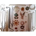 Vintage brooches to include a gold tone, turquoise and seed pearl brooch with matching clip-on