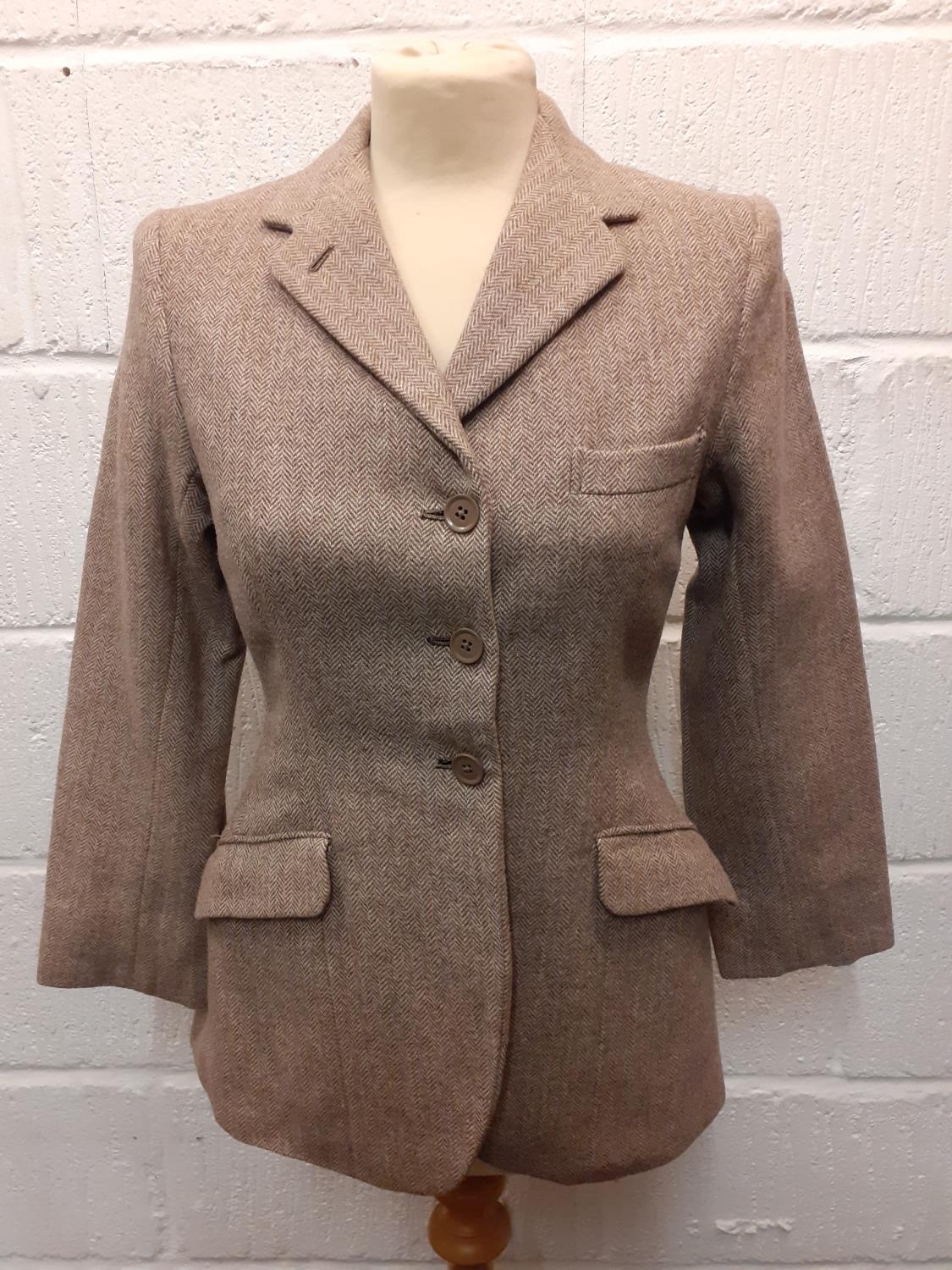 A 1960's Bedford Riding Breeches Company child's tan herringbone riding jacket, approx age 10-12.