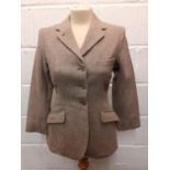 A 1960's Bedford Riding Breeches Company child's tan herringbone riding jacket, approx age 10-12.