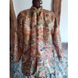 A 1930'S/1950'S Chinese jacket with Mandarin collar in cream having yellow rope knot buttons with