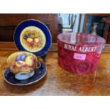 An Aynsley china cup, saucer and plate decorated with fruit, side plate signed D Jones, cup N