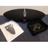 A Bowers & Wilkins Zeppelin Air audio system with cable, remote control and instruction manual.