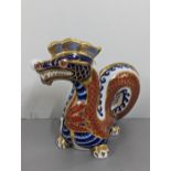 A Royal Crown Derby bone china seconds quality paperweight, in the form of a Chinese dragon, 11cm