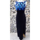 A modern ladies Bernshaw sleeveless black velvet evening gown having an electric blue stars and moon