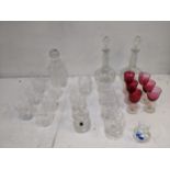 Glassware to include six cranberry wines, decanters, brandys, a set of six whisky glasses and