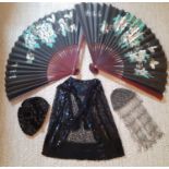 A 1920's black sequin cape having a button mesh ground decorated with black sequins throughout, a