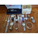 A quantity of gent's and ladies quartz wristwatches to include an Accutime Watch Corp Superman watch