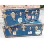 Two 1930's navy cabin/steamer trunks with various related travel advertising stickers to include