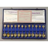 The twelve Roman spoons 22ct silver gilt, together with a case and certificate of authenticity,