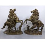 A pair of bronze Marley horses after Guilaume Couston (French 1677 1746)signed to the bases.