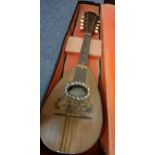 A Dunn & Davidson 'Arcade' mandolin, 8 string, 8 bone pegs and fitted case A/F