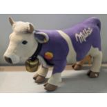 Steiff- A modern 'Milka' cow, wearing cow bell, having yellow tag and circular tag, approx 70cm x