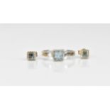 An 18ct white gold and aquamarine dress ring and matching earrings, set with central square cut
