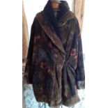 Kenzo-A vintage plush coat having brown, green and yellow tones with floral design. Location:Rail1