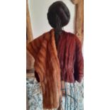 A vintage chestnut brown ermine cape together with a mid 20th Century red fox stole, a dark brown