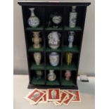 A set of twelve Franklin porcelain 'The Treasures of The Imperial Dynasties' miniature vases in an