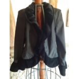 A Vera Mont black taffeta-effect evening jacket with black velvet ruffled hem, collar and cuffs