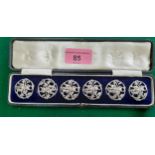 A cased set of 6 early 20th Century pierced silver buttons having a leaf design. Location:Cab