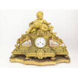 A late 19th century French gilt bronze mantel clock by Henry Marc, the case having two cherubs on