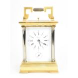 A 20th century brass carriage clock, retailed by Asprey & Co, in gilt and silvered metal case,