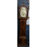 An 18th century mahogany longcase clock having pierced fretwork pediment with ball finials, fluted