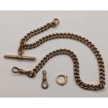 An early 20th century 9ct gold pocket watch curb link chain having T-bar and dog clip, 35cm total