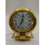 A Cartier, quartz, bedside/travel clock, the dial signed Cartier and having Roman numerals and