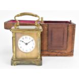 An early 20th century cased carriage clock, by Mortimer Ricks of Paignton, the brass case with