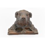 A Black Forest carved walnut tobacco jar modelled as a dog, realistically carved with texture