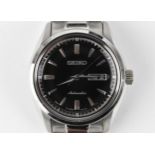 A Seiko, automatic, gents, stainless steel wristwatch, circa 2017, model 4R36-03H0, having a black