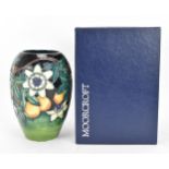 A Moorcroft pottery 'Passion Fruit' vase, designed by Rachel Bishop, 1998, painted by Carolyn