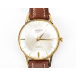 A Roamer Premier, manual wind, gents, 9ct gold wristwatch, circa 1964, having a silvered dial with
