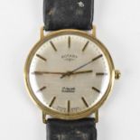 A Rotary, manual wind, gents, 9ct gold wristwatch, having a silvered dial with baton markers, centre